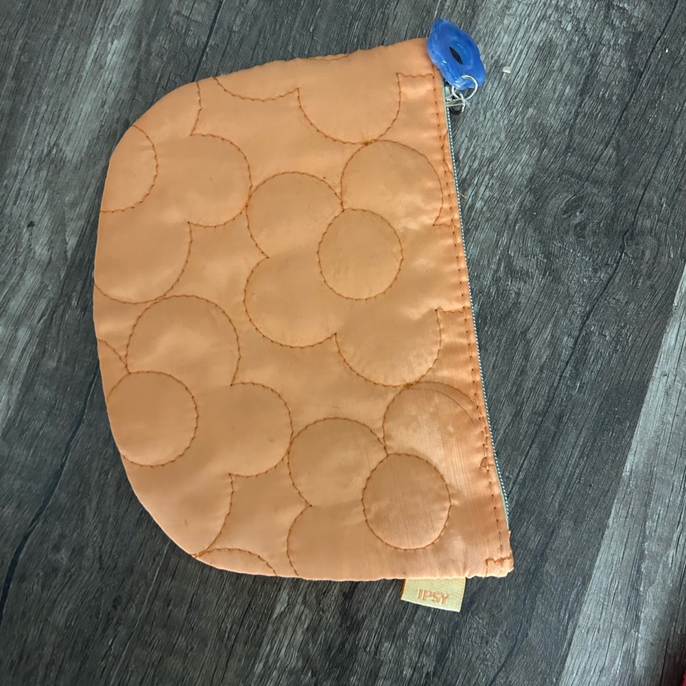 Ipsy Orange Quilted Pouch with Blue Zipper Pull